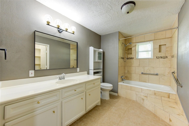 811 Strange Dr, Richmond, TX 77406 - bathroom with vanity, tile patterned flooring, a textured ceiling, toilet, and tiled shower / bath combo