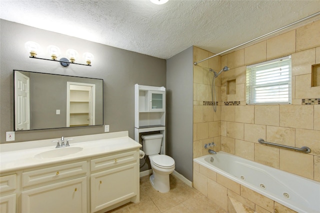 811 Strange Dr, Richmond, TX 77406 - bathroom with a combined bath / shower with jetted tub, a textured ceiling, vanity, tile patterned flooring, and toilet