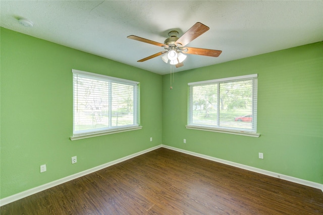 811 Strange Dr, Richmond, TX 77406 - unfurnished room with dark wood-style flooring, baseboards, and a ceiling fan
