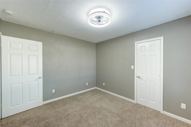 811 Strange Dr, Richmond, TX 77406 - carpeted spare room with baseboards and a textured ceiling