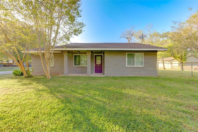 811 Strange Dr, Richmond, TX 77406 - ranch-style house with brick siding, fence, and a front lawn