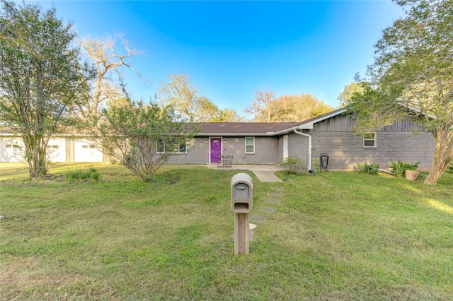 811 Strange Dr, Richmond, TX 77406 - ranch-style home featuring a front yard and brick siding