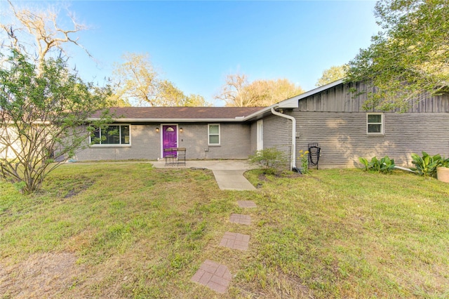 811 Strange Dr, Richmond, TX 77406 - single story home featuring board and batten siding, a front lawn, and brick siding