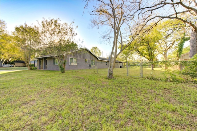 811 Strange Dr, Richmond, TX 77406 - view of yard featuring fence and a gate