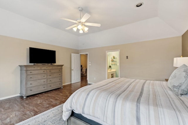 bedroom featuring baseboards, a ceiling fan, connected bathroom, wood finished floors, and lofted ceiling