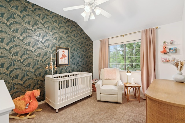 bedroom with carpet floors, a ceiling fan, vaulted ceiling, and wallpapered walls