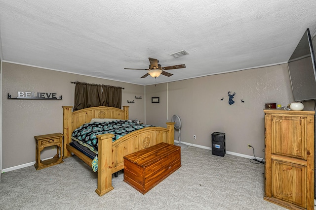 bedroom featuring baseboards, light carpet, a textured ceiling, visible vents, and ceiling fan