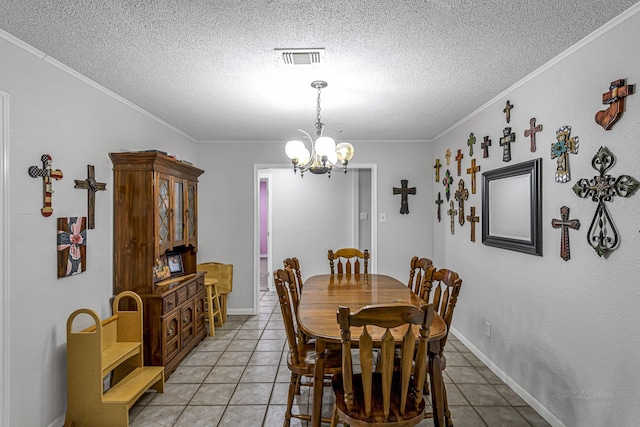 dining space with light tile patterned floors, a chandelier, visible vents, and a textured ceiling