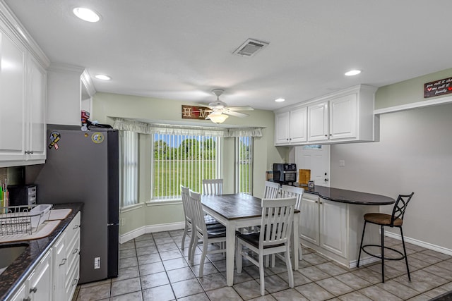 dining space featuring light tile patterned flooring, baseboards, a ceiling fan, and recessed lighting
