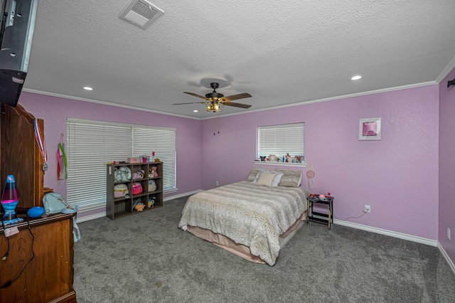bedroom featuring visible vents, a textured ceiling, ornamental molding, and carpet floors