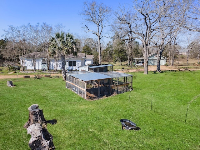 view of yard with exterior structure and an outbuilding