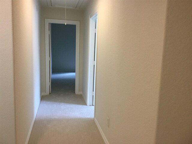 4810 N Pine Brook Way, Houston, TX 77059 - corridor with attic access, light carpet, and baseboards