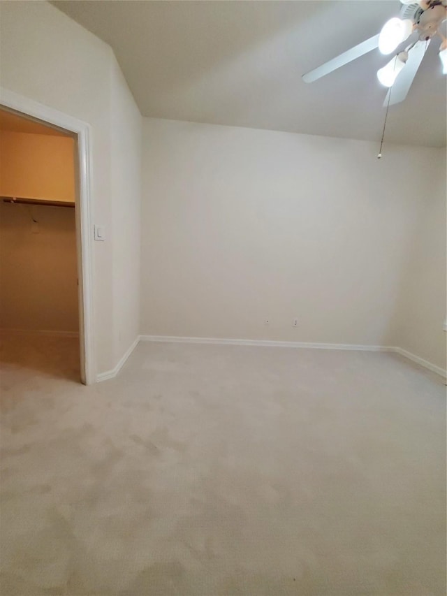 4810 N Pine Brook Way, Houston, TX 77059 - unfurnished bedroom featuring light colored carpet, a spacious closet, a ceiling fan, a closet, and vaulted ceiling