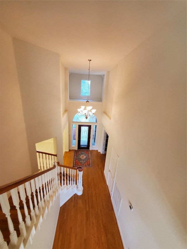 4810 N Pine Brook Way, Houston, TX 77059 - entryway with wood finished floors, a chandelier, a towering ceiling, and baseboards