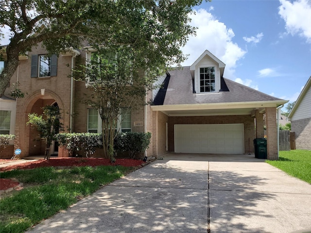 4810 N Pine Brook Way, Houston, TX 77059 - view of front of house with brick siding, driveway, a garage, and roof with shingles