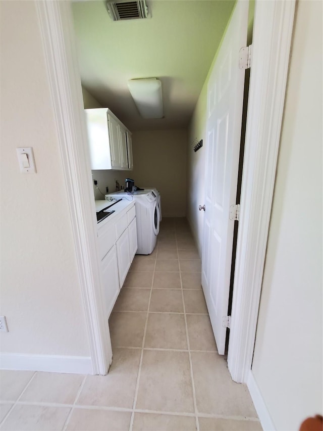 4810 N Pine Brook Way, Houston, TX 77059 - laundry room featuring cabinet space, washer / clothes dryer, light tile patterned flooring, and baseboards