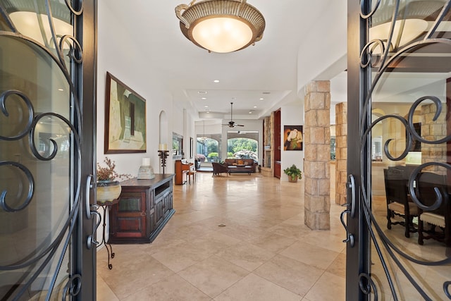 entrance foyer with recessed lighting, ornate columns, a ceiling fan, and light tile patterned flooring