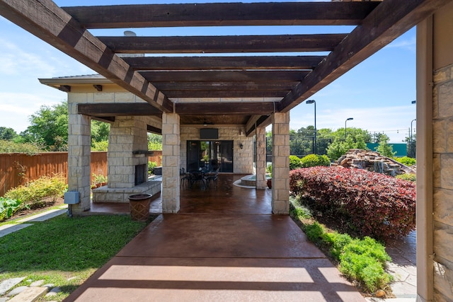 view of patio / terrace with a pergola and fence