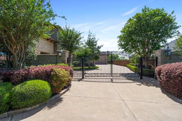 view of gate featuring fence