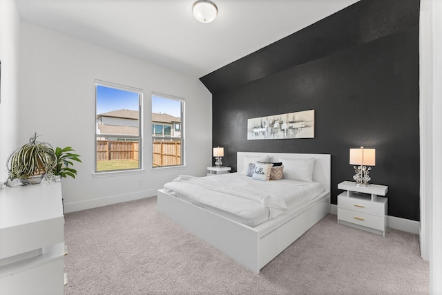 bedroom featuring baseboards and carpet floors