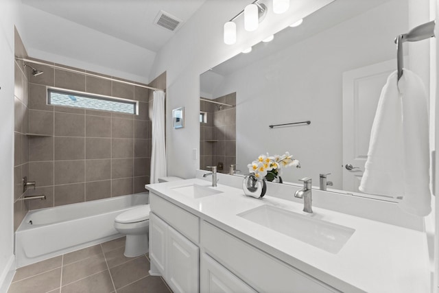 bathroom featuring a sink, visible vents, tile patterned floors, and shower / bath combo with shower curtain