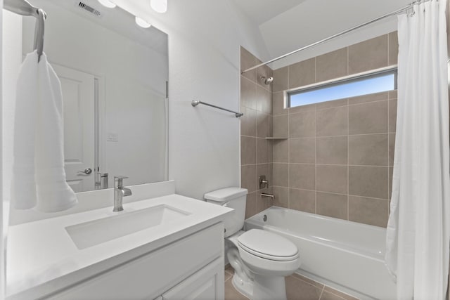 full bathroom with vanity, tile patterned flooring, visible vents, toilet, and shower / bath combo with shower curtain
