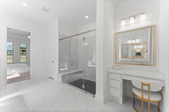 ensuite bathroom featuring a shower stall, ensuite bathroom, baseboards, and ceiling fan