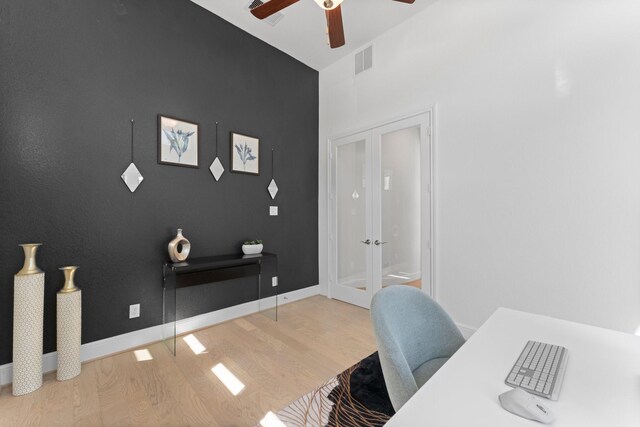 office area featuring visible vents, baseboards, a ceiling fan, wood finished floors, and french doors