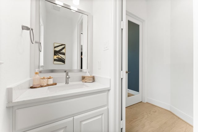 bathroom featuring vanity and wood finished floors