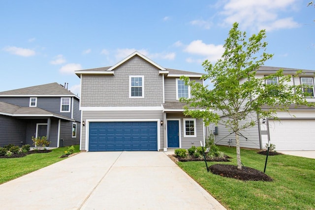 traditional-style home featuring an attached garage, concrete driveway, and a front lawn