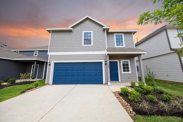 traditional-style house featuring driveway and a garage