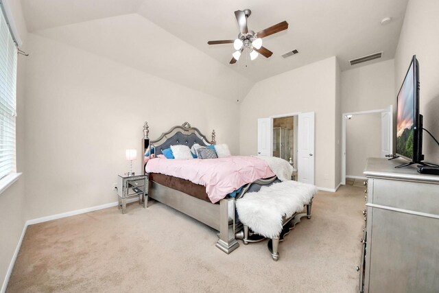 bedroom with baseboards, visible vents, light carpet, and lofted ceiling