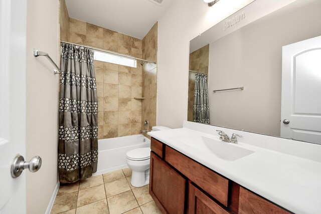 bathroom with toilet, shower / tub combo, vanity, and baseboards