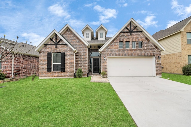 craftsman-style home with driveway, a front lawn, and brick siding