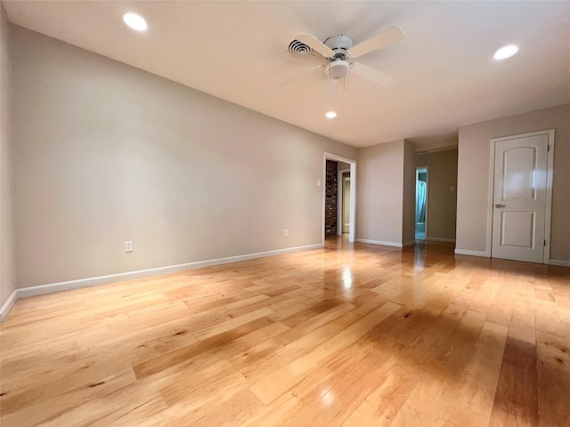 empty room with recessed lighting, light wood finished floors, baseboards, and ceiling fan