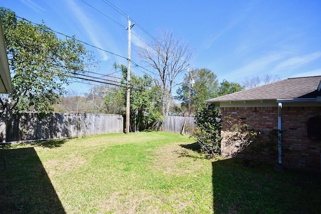 view of yard with fence