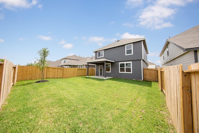 back of property featuring a patio, a lawn, and a fenced backyard