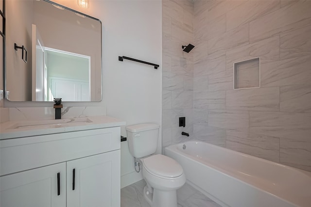 bathroom featuring marble finish floor, toilet, vanity, and tub / shower combination