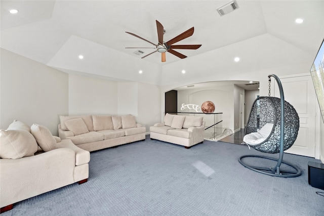 carpeted living area featuring arched walkways, recessed lighting, visible vents, and ceiling fan