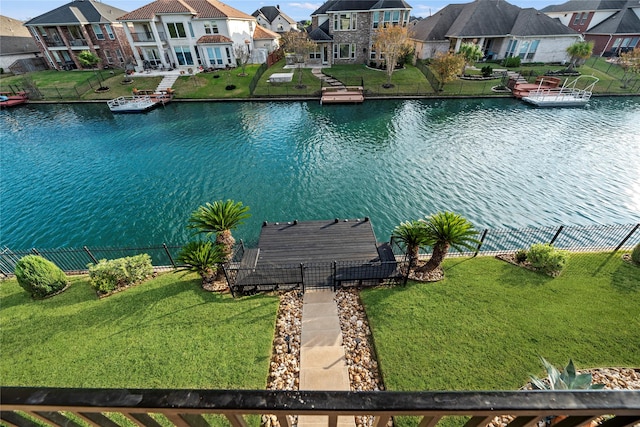 water view with fence and a residential view