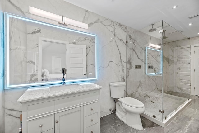 bathroom with vanity, visible vents, toilet, marble finish floor, and a marble finish shower