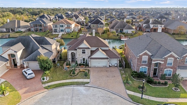 bird's eye view featuring a residential view and a water view