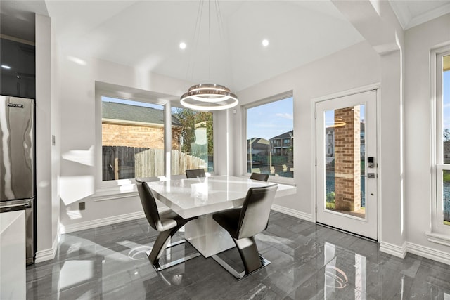 dining space featuring a chandelier, recessed lighting, and baseboards