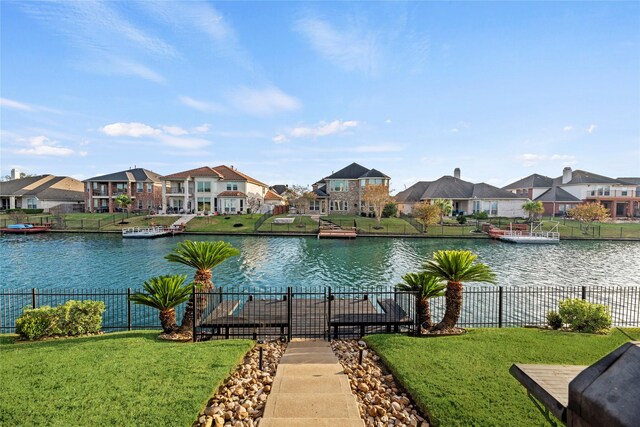 view of water feature featuring a residential view and fence