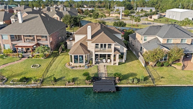 aerial view featuring a water view and a residential view