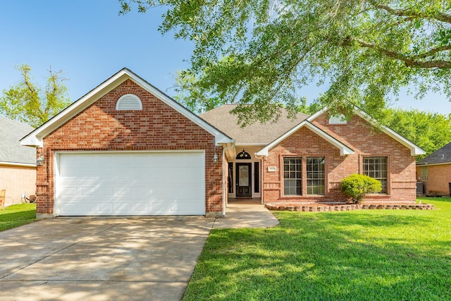 207 Audubon Woods Ct, Richwood, TX 77531 - ranch-style home with a front yard, brick siding, concrete driveway, an attached garage, and a shingled roof