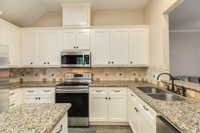 207 Audubon Woods Ct, Richwood, TX 77531 - kitchen with dark wood-style flooring, light stone countertops, appliances with stainless steel finishes, a sink, and tasteful backsplash