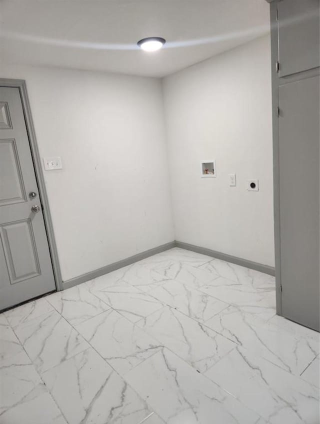empty room with marble finish floor and baseboards