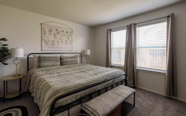carpeted bedroom featuring multiple windows