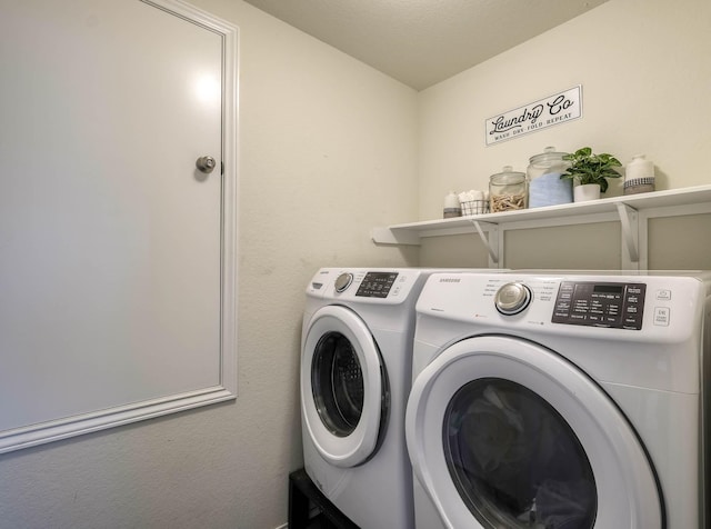 laundry area with washer and dryer and laundry area